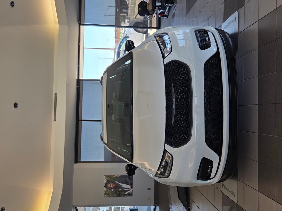 White Chrysler Pacifica with BraunAbility Side Entry Automatic In Floor conversion