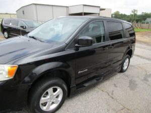 Black Dodge Grand Caravan with BraunAbility Side Entry Automatic Fold Out conversion