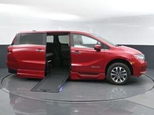 Red Honda Odyssey with BraunAbility Side Entry Automatic In Floor conversion