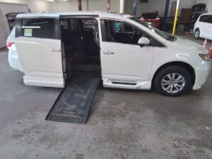 White Honda Odyssey with BraunAbility Side Entry Automatic Fold Out conversion