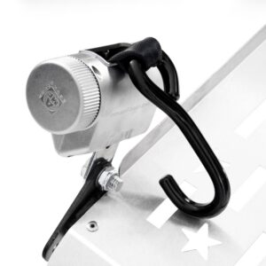 Close-up of a Harmar Fusion Lift (AL300-MW) metal lock device featuring a combination dial and black hook, secured to a metallic surface with bolts and cut-out star shapes.