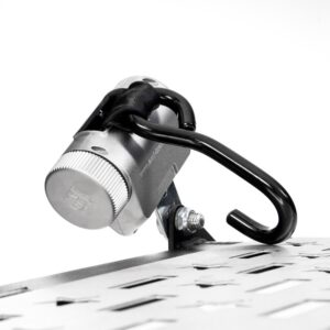 A Harmar Fusion Lift (AL300-MW) metal combination lock with a black hook is affixed to a perforated metal surface, secured by a bolt against a white background.