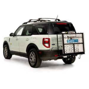 A white SUV with a Harmar Fusion Lift (AL300-MW) attached to its rear hitch, viewed from the back left side against a white background.