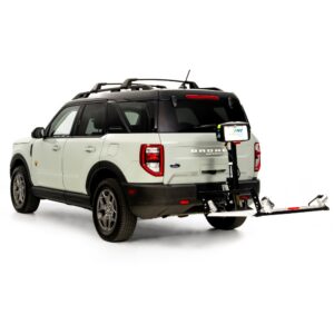 A white Ford Bronco Sport SUV with a rear-mounted Harmar Fusion Lift (AL300-MW) bike rack attached, carrying a single bicycle tire and license plate.