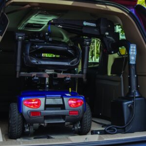 A mobility scooter is secured inside a vehicle with the Harmar Premium Inside Lift (AL435), featuring a control panel and mechanical arm for easy loading and unloading.