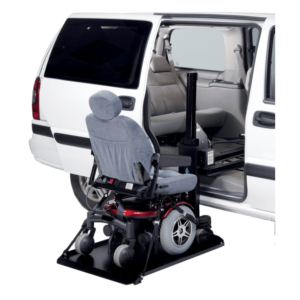 The Harmar Side Door Hybrid Platform Lift (AL690) is installed at the side door of a white van, ready to transfer motorized wheelchairs and scooters into the vehicle.