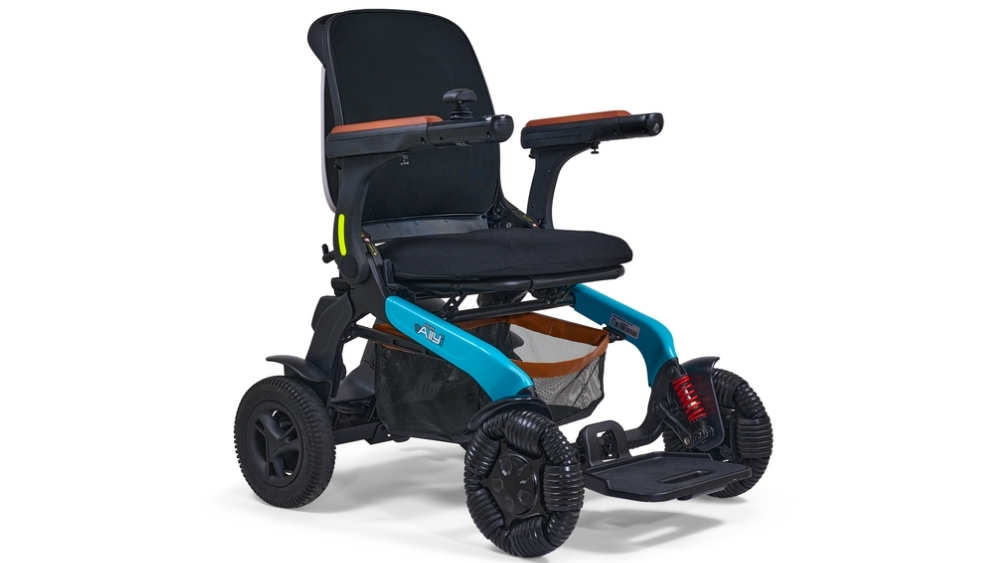 A compact Ally Pro Power Wheelchair in blue and black, featuring armrests, a footplate, and an under-seat storage basket.