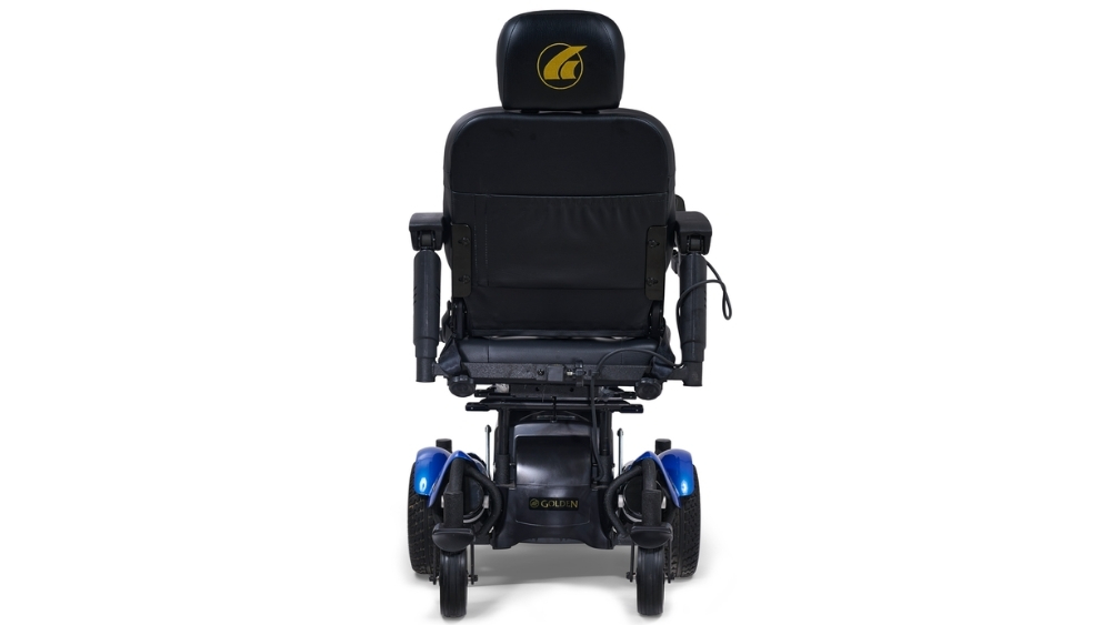 Compass HD Power Wheelchair shown facing forward, with a black seat and armrests, blue wheel covers, and a Compass HD logo displayed on the headrest.