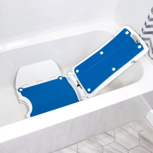 A BathLyft Power Bathtub Lift in blue and white is set up inside a white bathtub, with hexagonal floor tiles nearby.