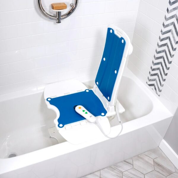 A BathLyft Power Bathtub Lift in blue and white, designed for the eco traveller sb7e lifestyle and featuring a remote control, is placed inside a white bathtub in a tiled bathroom.