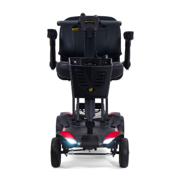 Front view of the Buzzaround CarryOn HD 4-Wheel Scooter in black, featuring armrests, seatback, foot platform, storage basket, and illuminated headlights.