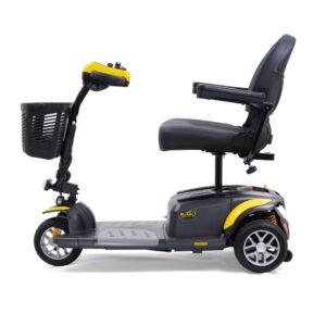 The BuzzAround EX 3-Wheel Scooter is a three-wheeled electric mobility scooter with a black seat, armrests, front basket, and yellow and gray accents, shown from the side.
