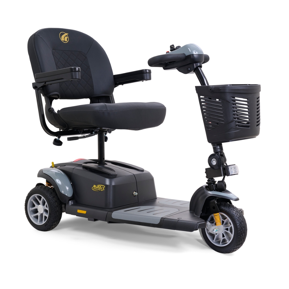 A black BuzzAround EX 3-Wheel Scooter by Golden Technologies, featuring a padded seat, armrests, handlebars, and a front basket, is shown on a white background.