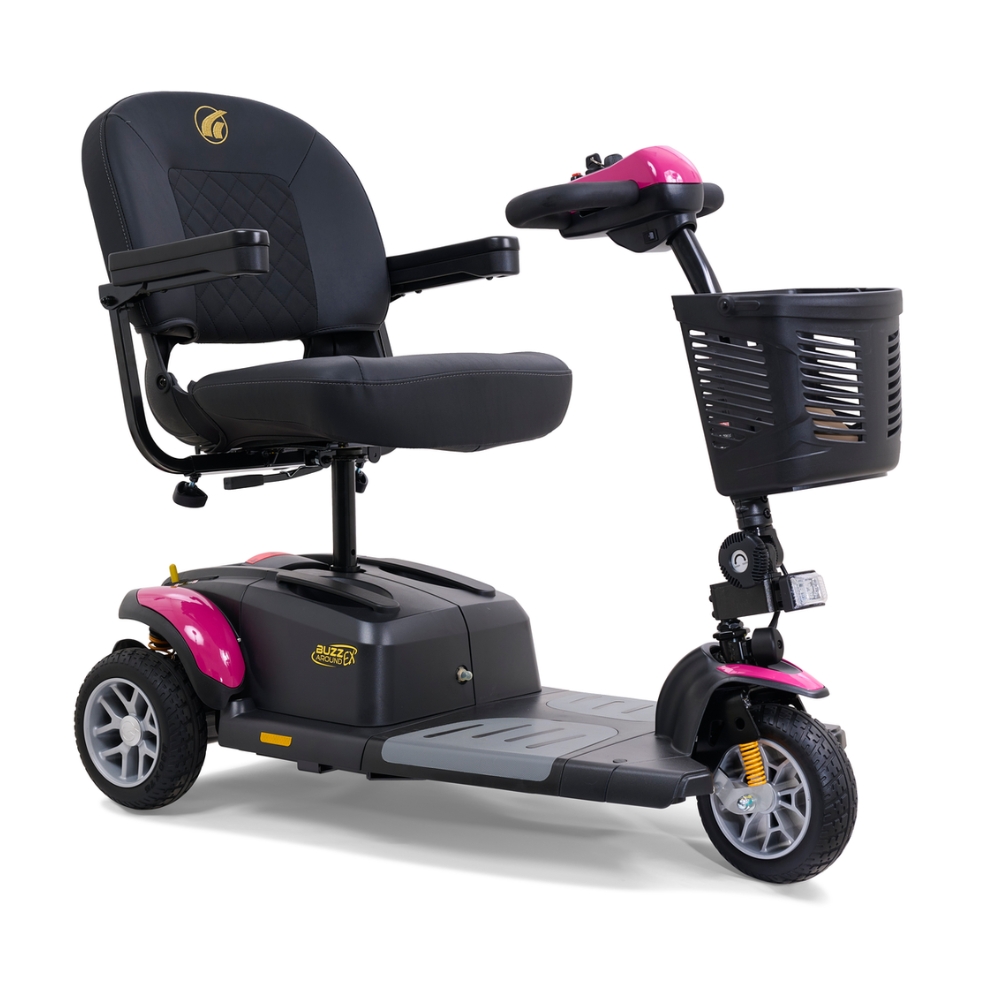 A black and pink BuzzAround EX 3-Wheel Scooter by Golden Technologies, featuring armrests, a front basket, and a padded seat.