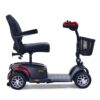 The BuzzAround EX 4-Wheel Scooter in red and black includes a padded seat, armrests, an easy-to-use control panel, and a handy front basket for essentials.