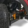 Close-up of the BuzzAround EX 4-Wheel Scooters suspension system showcasing robust golden GB148 springs, shock absorbers, and black treaded tires.