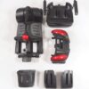Disassembled parts of a BuzzAround EX 4-Wheel Scooter, including a seat, base, front section with wheels, basket, and two side panels, are neatly arranged on a white surface.