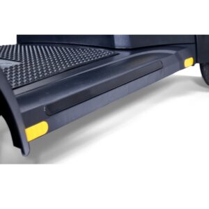 Close-up of the Buzzaround XL 4-Wheel Scooter's black running board with textured surface and yellow safety markings, attached to the scooter's lower side.