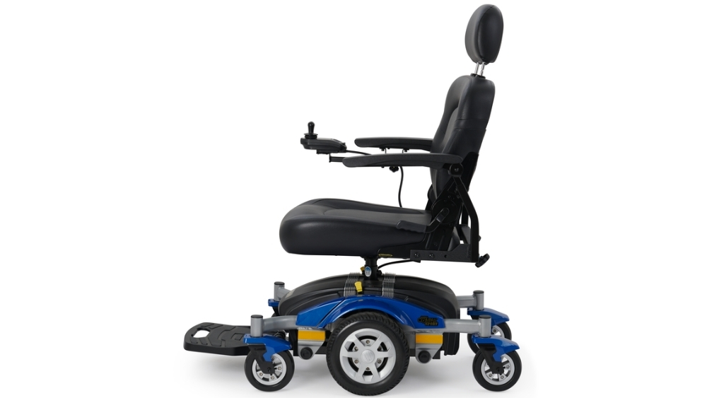 A Compass Sport Power Wheelchair in blue and black, featuring a high backrest, armrests, headrest, footrest, and joystick control, shown in profile view.