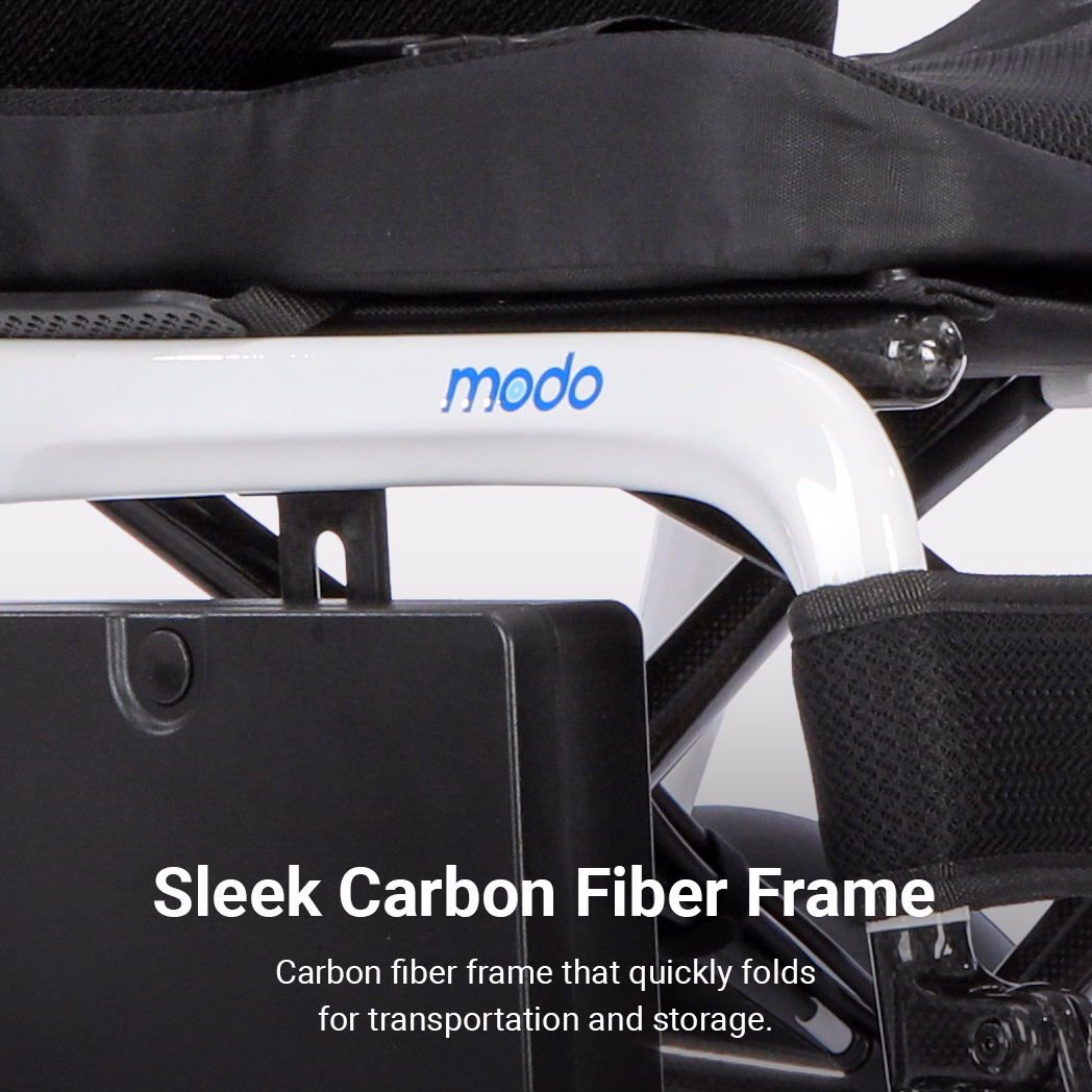 Close-up of the Modo Breeze: a white carbon fiber wheelchair frame with modo label, black seat, and the text Sleek Carbon Fiber Frame at the bottom.