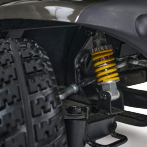 Close-up view of the Companion 4-Wheel Scooter’s suspension system, featuring a yellow coil spring, shock absorber, and part of a large tire.