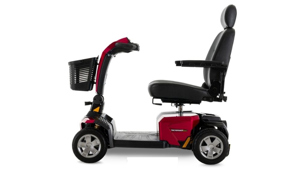 Victory LX Sport 4-Wheel Scooter in red, featuring a black cushioned seat with armrests and backrest, plus a front basket, shown in side profile against a white background.