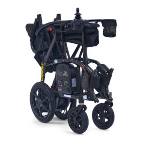 The Golden Cricket LT Side-Folding Carbon Fiber Power Wheelchair features large rear wheels, smaller front wheels, a mesh basket, and a control joystick on the armrest, all in a convenient folded design.