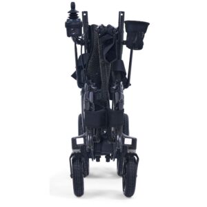 The Golden Cricket LT Side-Folding Carbon Fiber Power Wheelchair stands upright when folded, highlighting its compact design, joystick control, front wheels, and a convenient cup holder attachment.