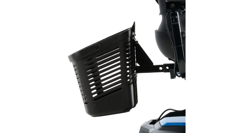 Close-up of a black plastic basket with horizontal ventilation slits and a handle, attached to the back of a Go Chair Power Wheelchair.