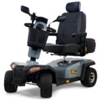 The Eagle All-Terrain Scooter is a four-wheeled mobility scooter featuring a padded seat, armrests, handlebars, front basket, and rear storage compartment, with "EAGLE" displayed on the side.