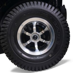 Close-up of a black rubber tire with a silver metal rim and visible tread pattern, mounted on the Eagle All-Terrain Scooter.