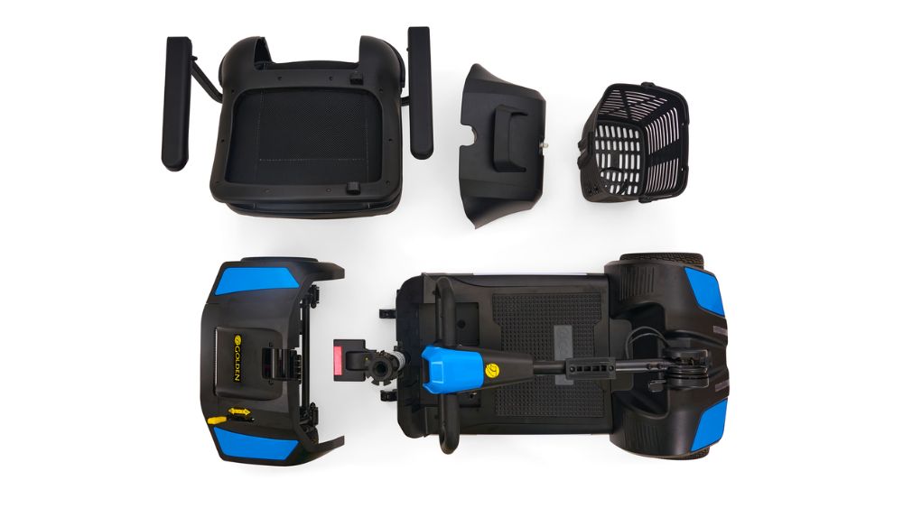 Top-down view of a disassembled Buzzaround XL 4-Wheel Scooter, displaying the main base, seat, front cover, basket, and rear cover arranged separately against a white background.