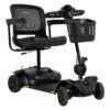 A black mobility scooter with a mesh backrest, armrests, a front basket, and four wheels. The model is listed as Go-Go on the base.