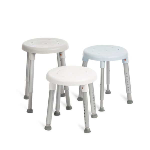 Three Etac Easy Shower Stools in white and light blue, featuring round plastic seats, adjustable metal legs, and rubber feet, are displayed on a white background.