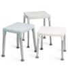 Three Etac Smart Shower Stools with square seats in white and light blue, each featuring an adjustable height, four metal legs, and non-slip rubber feet.