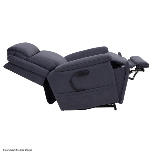 A dark gray Evolution Lift Chair fully reclined, featuring an extended footrest and a wired remote control attached to the side.