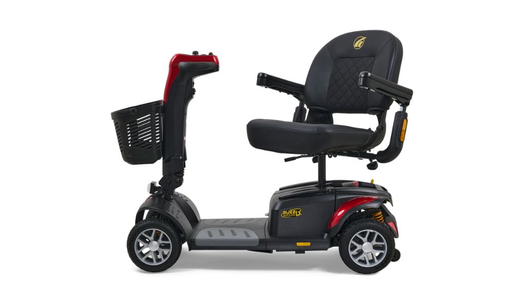 A BuzzAround LX 3-Wheel Scooter featuring a black seat with armrests, a front basket, and gray and red accents, is shown from the side.