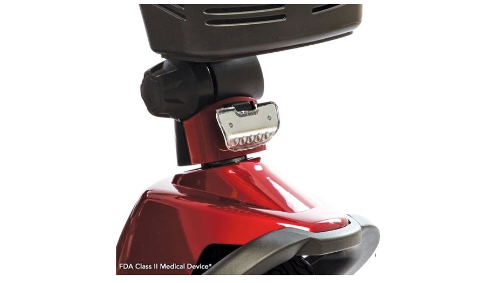 Close-up view of the front section of a red Victory 10 3-Wheel Scooter, highlighting the headlight and part of the wheel cover. Text at the bottom reads: “FDA Class II Medical Device.”.