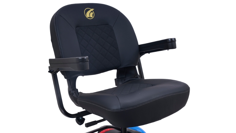 Black cushioned seat with armrests and a gold logo on the headrest of the BuzzAround EX 4-Wheel Scooter, pictured against a white background.