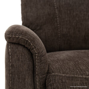 Close-up of a brown fabric chair, reminiscent of the Genesis Lift Chair, showcasing intricate stitching on the armrest and backrest.
