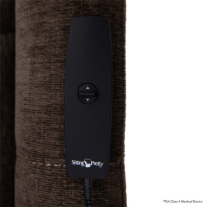 A black remote control with two buttons rests on a brown textured surface, featuring the Sitting Pretty text. Its perfect for enhancing your experience with the Genesis Lift Chair.