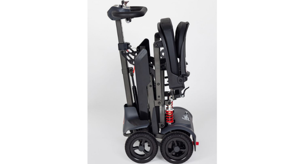 Side view of a folded Monarch Mobility Genie Auto portable mobility scooter.