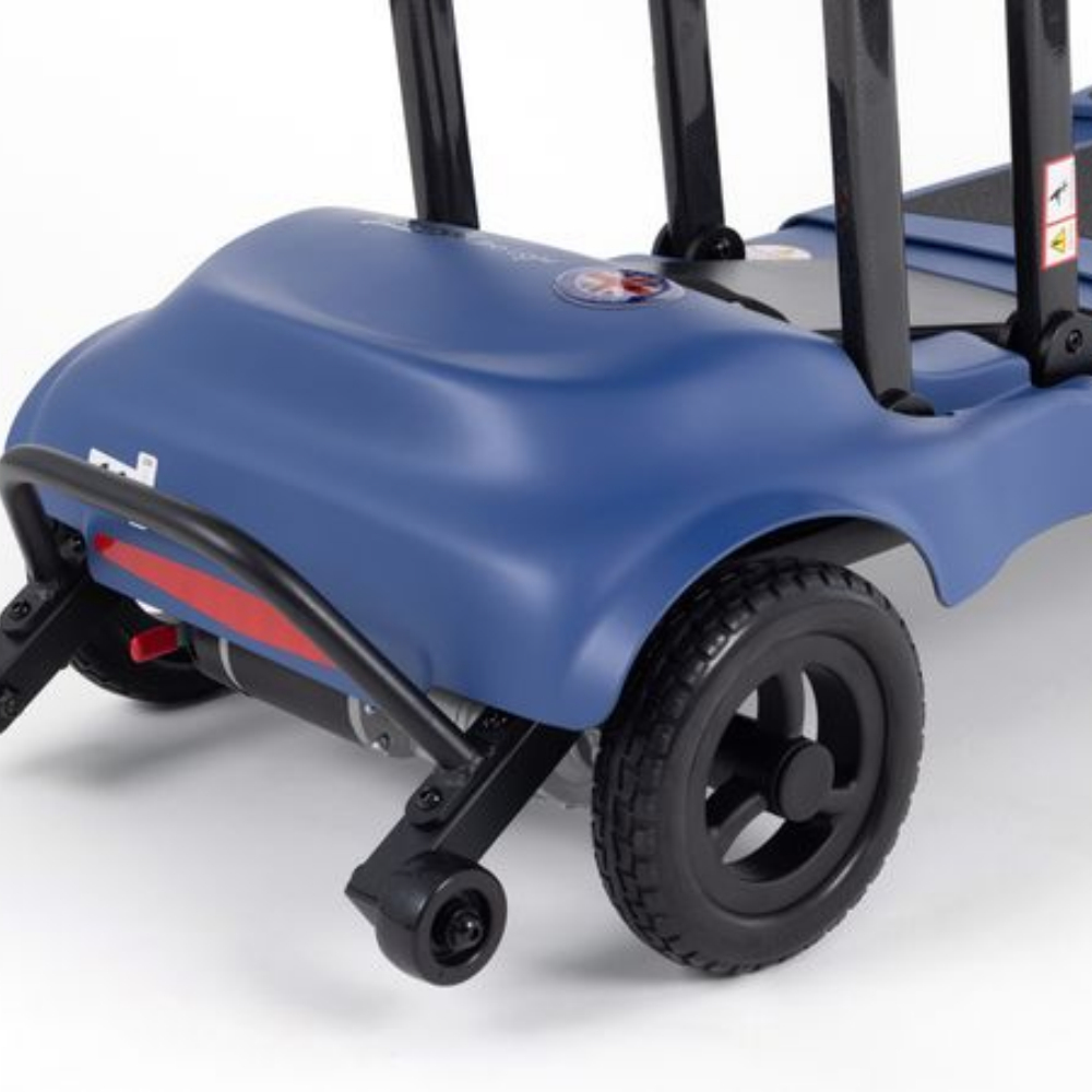 Rear view of a blue Monarch Mobility Genie Ultralight mobility scooter showing the wheels, back bumper, and frame.