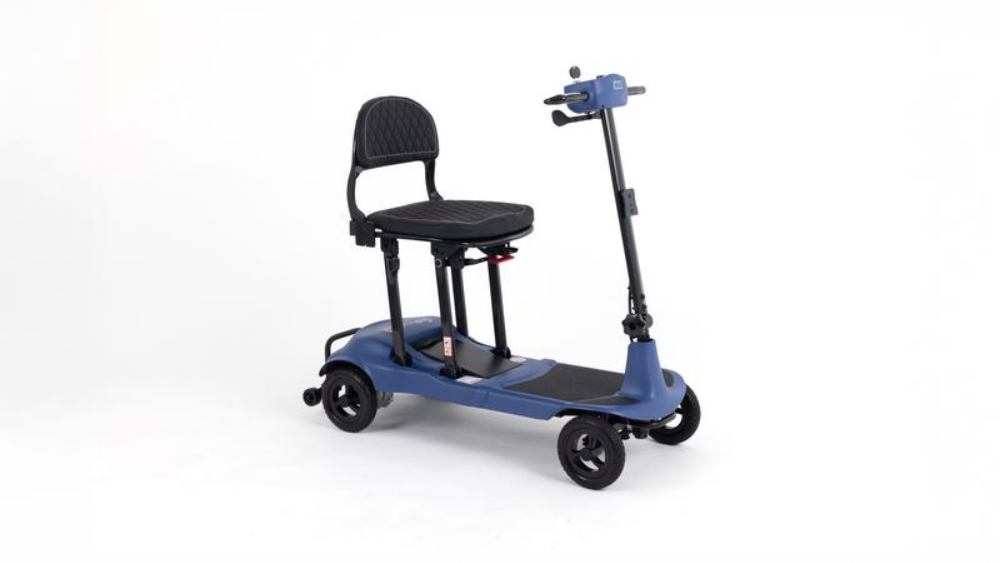Blue four-wheeled Monarch Mobility Genie Ultralight folding mobility scooter with a black padded seat and a single tiller handle.