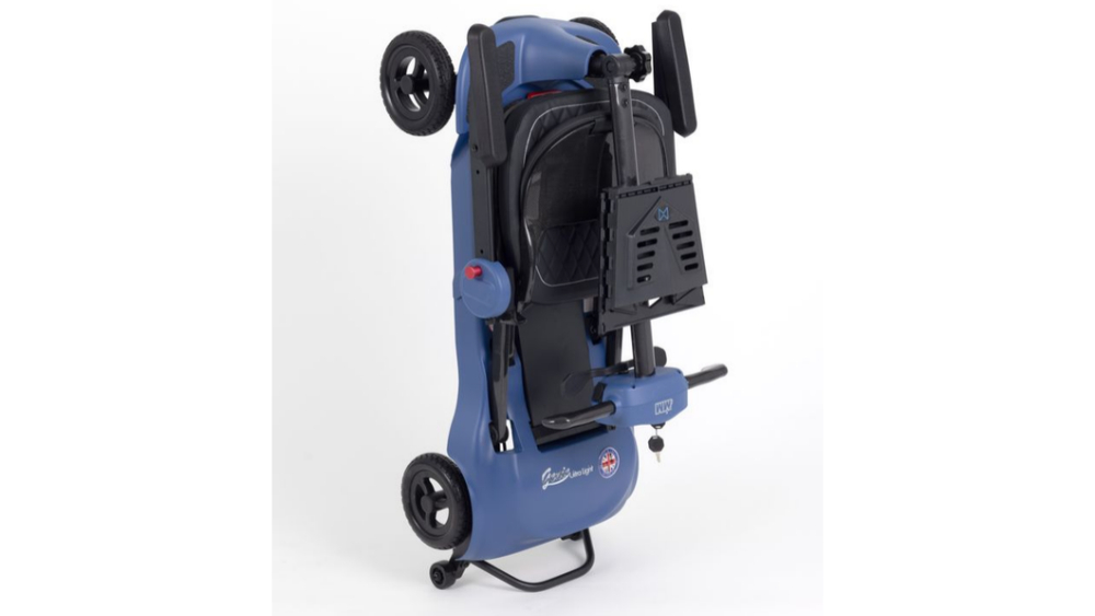 Blue Monarch Mobility Genie Ultralight mobility scooter folded into an upright, compact position.