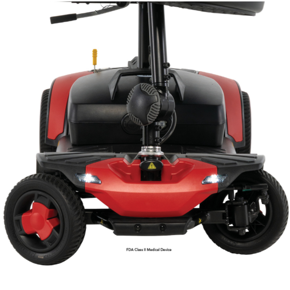 Front view of a red and black Go Go Elite Traveller Gen 3 mobility scooter, showing two wheels, headlights, and part of the control column.