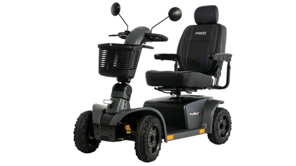 The Pursuit 2 4-Wheel Scooter is a black mobility scooter equipped with four wheels, a padded seat, armrests, headrest, front basket, and side mirrors, designed for personal transportation.