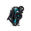 A teal and black Ally Power Wheelchair folded compactly, its wheels visible, set against a white background.
