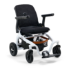 The Ally Power Wheelchair features a black seat, right-arm joystick control, white frame, four wheels, and a storage basket under the seat.