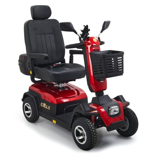 A red Eagle 4-Wheel Scooter by Golden Technologies with a black cushioned seat, armrests, front basket, handlebars, and four wheels, shown from a front-side angle.
